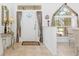 Bright foyer featuring tile flooring and a decorative window above the front door at 39 Medalist Ln, Rotonda West, FL 33947