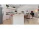 Functional kitchen with white cabinetry and an open layout to the living room at 39 Medalist Ln, Rotonda West, FL 33947