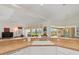 Bright kitchen with a view of the backyard, breakfast bar, and white cabinets at 39 Medalist Ln, Rotonda West, FL 33947
