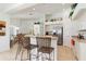Open kitchen with stainless steel appliances, breakfast bar, and ample cabinet space at 39 Medalist Ln, Rotonda West, FL 33947