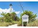 Historic Gasparilla Island Lighthouse view featuring walking trails surrounded by greenery at 39 Medalist Ln, Rotonda West, FL 33947