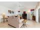 Inviting living room featuring tile floors, neutral tones, and plenty of natural light at 39 Medalist Ln, Rotonda West, FL 33947