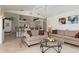 Open-concept living area with kitchen view, neutral palette, and lots of natural light at 39 Medalist Ln, Rotonda West, FL 33947