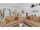 Spacious living room with tile flooring and elegant furnishings, open to dining area at 39 Medalist Ln, Rotonda West, FL 33947
