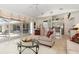 Spacious living area with tile floors, access to outdoor space and adjacent to kitchen at 39 Medalist Ln, Rotonda West, FL 33947