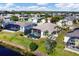 Aerial shot of homes with screened-in pools and waterfront views in a well-kept neighborhood at 4115 Hemingway Dr, Venice, FL 34293
