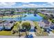 Captivating aerial view of the property, highlighting its proximity to a beautiful lake at 4115 Hemingway Dr, Venice, FL 34293