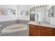 Elegant bathroom with a soaking tub and decorative features at 4115 Hemingway Dr, Venice, FL 34293