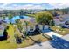 Charming home with a well-maintained lawn, mature trees, and a picturesque lake view at 4115 Hemingway Dr, Venice, FL 34293