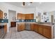 Traditional kitchen with wood cabinets, stainless steel appliances and tiled backsplash at 4115 Hemingway Dr, Venice, FL 34293