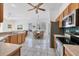 Bright, open kitchen featuring a cozy breakfast nook with seating and stainless steel appliances at 4115 Hemingway Dr, Venice, FL 34293