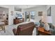 Bright living room with sliding doors to screened-in lanai and pool at 4115 Hemingway Dr, Venice, FL 34293