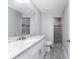 Bathroom with granite countertop, tiled shower, and modern fixtures at 5273 Gillot Blvd, Port Charlotte, FL 33981