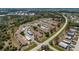 Extensive aerial view of a vibrant 55+ community surrounded by scenic lakes and lush greenery at 6796 Gasparilla Pines Blvd # 63, Englewood, FL 34224