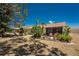 Exterior shot showing the back of the house with a screened lanai and lush landscaping at 6796 Gasparilla Pines Blvd # 63, Englewood, FL 34224
