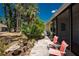 Back patio with lush greenery featuring lounge chairs and outdoor seating, perfect for relaxation and entertaining at 6796 Gasparilla Pines Blvd # 63, Englewood, FL 34224