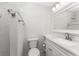 Updated bathroom featuring a white vanity with a granite countertop, sleek fixtures, and a tiled shower at 6796 Gasparilla Pines Blvd # 63, Englewood, FL 34224