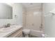Neutral toned bathroom featuring a combination tub and shower, and a vanity with ample lighting at 6796 Gasparilla Pines Blvd # 63, Englewood, FL 34224