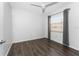 Bedroom with hardwood flooring, a ceiling fan, and a window that offers natural light at 6796 Gasparilla Pines Blvd # 63, Englewood, FL 34224