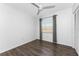 Inviting bedroom boasting hardwood flooring, a ceiling fan, and a well-sized closet at 6796 Gasparilla Pines Blvd # 63, Englewood, FL 34224