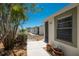Charming single-story villa with a well-manicured front yard and a clear blue sky at 6796 Gasparilla Pines Blvd # 63, Englewood, FL 34224