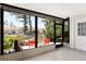 Enclosed lanai offering an extended space for relaxation with views of the outdoor landscape at 6796 Gasparilla Pines Blvd # 63, Englewood, FL 34224