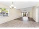Open floor plan featuring luxury vinyl plank and tile flooring, as well as natural lighting at 6796 Gasparilla Pines Blvd # 63, Englewood, FL 34224
