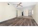 Spacious living room with ceiling fan and open floor plan to dining area and kitchen at 6796 Gasparilla Pines Blvd # 63, Englewood, FL 34224