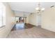 Bright living room featuring luxury vinyl plank and tile flooring, and vaulted ceiling at 6796 Gasparilla Pines Blvd # 63, Englewood, FL 34224