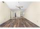 Bright and open living room with laminate flooring leading into the dining area and front door at 6796 Gasparilla Pines Blvd # 63, Englewood, FL 34224