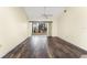 Light filled open living room with vaulted ceilings, ceiling fan and access to a screened in patio at 6796 Gasparilla Pines Blvd # 63, Englewood, FL 34224