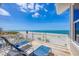 Outdoor balcony with seating overlooking the beach and ocean at 6890 Palm Island Dr, Placida, FL 33946