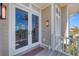 Inviting balcony features french doors and scenic outdoor views, highlighting coastal living at 6890 Palm Island Dr, Placida, FL 33946