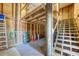 Unfinished basement with exposed wood framing, stairs and great potential at 6890 Palm Island Dr, Placida, FL 33946