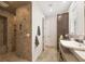 Bathroom featuring a tiled walk-in shower, modern vanity, and neutral finishes at 6890 Palm Island Dr, Placida, FL 33946