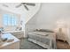 Charming bedroom featuring sloped ceilings, a cozy nook and plush gray carpeting at 6890 Palm Island Dr, Placida, FL 33946