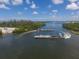 Aerial view of two ferries crossing a waterway, connecting communities with reliable transport amid scenic waterscapes at 6890 Palm Island Dr, Placida, FL 33946