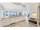 Bright kitchen with stainless steel appliances, ocean view windows, and ample counter space at 6890 Palm Island Dr, Placida, FL 33946