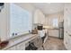 Well-lit laundry room with modern appliances, a built-in desk and lots of storage at 6890 Palm Island Dr, Placida, FL 33946