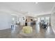 Expansive living area with kitchen, dining, and outdoor access, perfect for entertaining at 6890 Palm Island Dr, Placida, FL 33946