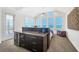 Bright main bedroom with vaulted ceilings, water views, and custom built-ins at 6890 Palm Island Dr, Placida, FL 33946
