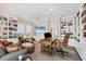 Bright office space with custom bookshelves and a comfortable seating area at 6890 Palm Island Dr, Placida, FL 33946