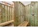Private outdoor shower featuring wood planks and a convenient bench at 6890 Palm Island Dr, Placida, FL 33946
