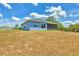 The backyard features a covered lanai and black metal fencing at 7332 Brandywine Dr, Englewood, FL 34224
