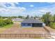 Rear view of home with screened lanai and fenced yard at 7332 Brandywine Dr, Englewood, FL 34224