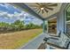 Screened lanai featuring outdoor seating with a view of the well maintained lawn and access to the kitchen at 7332 Brandywine Dr, Englewood, FL 34224