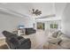 Spacious living room with a ceiling fan, recessed lighting, and sliding glass doors to the outdoors at 7332 Brandywine Dr, Englewood, FL 34224