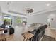 Bright living room with a ceiling fan, recessed lighting, and an open layout into the kitchen at 7332 Brandywine Dr, Englewood, FL 34224