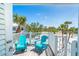 Relaxing balcony with ocean views and cozy seating, perfect for enjoying the tropical scenery at 7548 Palm Island S Dr # 1724, Placida, FL 33946