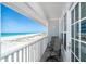 Balcony with chairs offers stunning views of the Gulf of Mexico and beach access at 7548 Palm Island S Dr # 1724, Placida, FL 33946